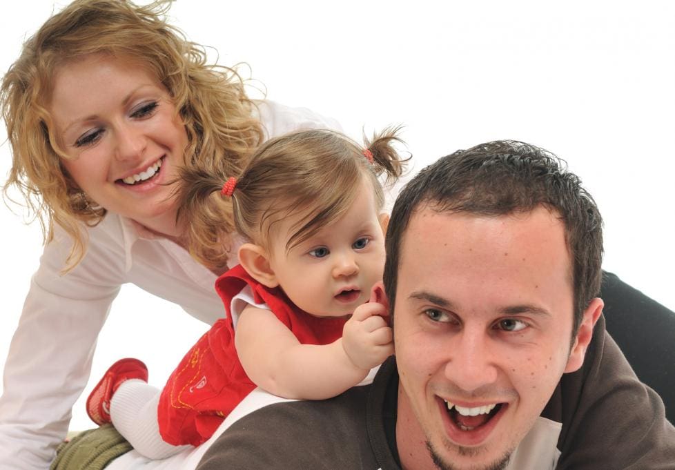 Happy family playing together, smiling and joyful.